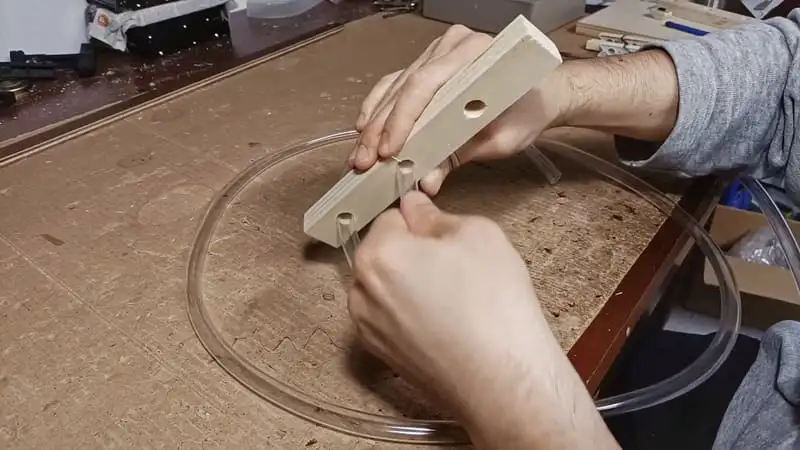 Inserting the tube into the DIY tube spiral for ants
